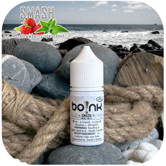 boInk Smash e-liquid bottle on a rocky beach with ocean view