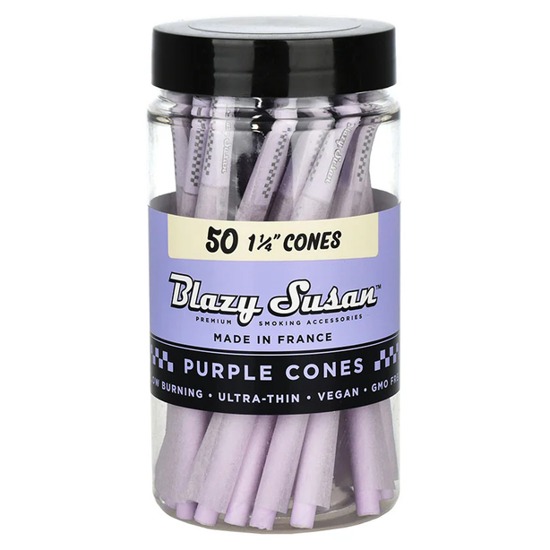 A clear plastic jar of Blazy Susan Purple Cones, 1 1/4 inches, containing 50 thin purple smoking accessories, with a black lid and a purple and black label.