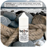 Boink e-liquid bottle on a rocky beach with a Health Canada warning label.