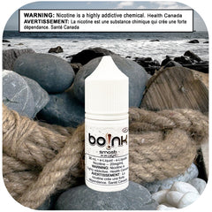 Boink e-liquid bottle on a rocky beach with a Health Canada warning label.