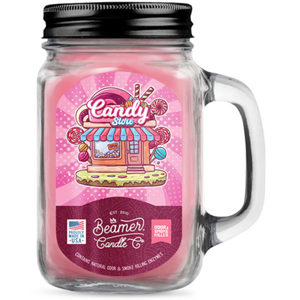 Glass jar candle with a candy-themed label on a white background