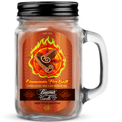 Cinnamon Fire Ball candle in a glass jar with a black lid on a white background