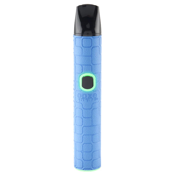 A blue Oooze Pinch Dry Herb device with a textured light blue body, a black mouthpiece, and a glowing green button, shown on a solid white background.
