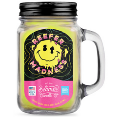 Mason jar candle with 'Reefer Madness' label on a white background
