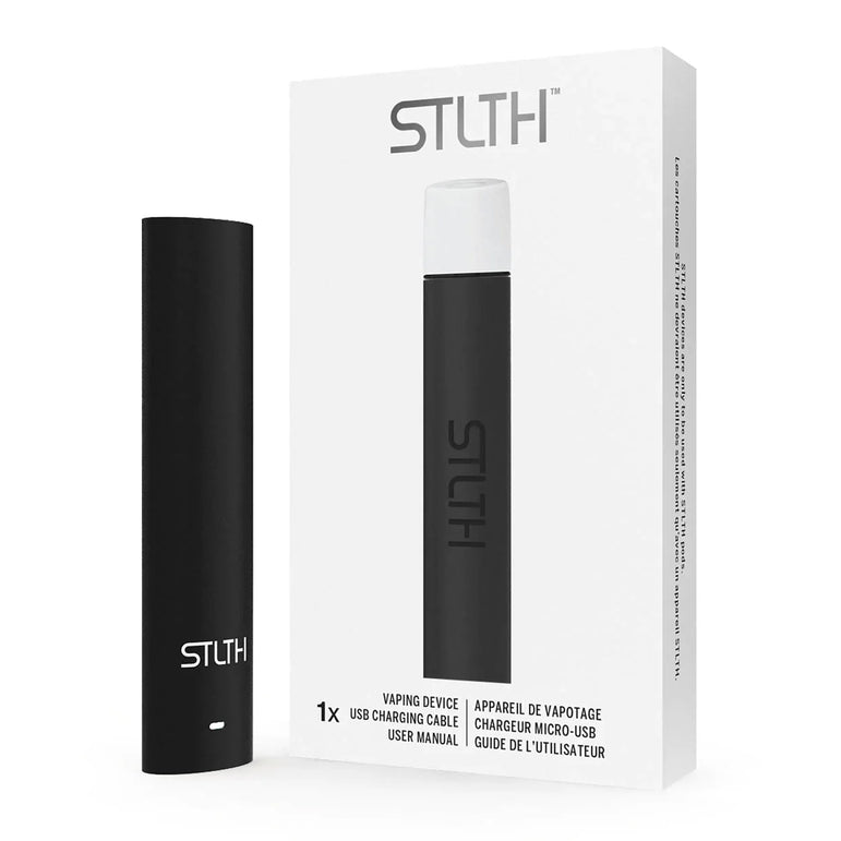 A black STLTH vaping device standing next to its white retail packaging box, which displays the STLTH logo and product details in English and French.