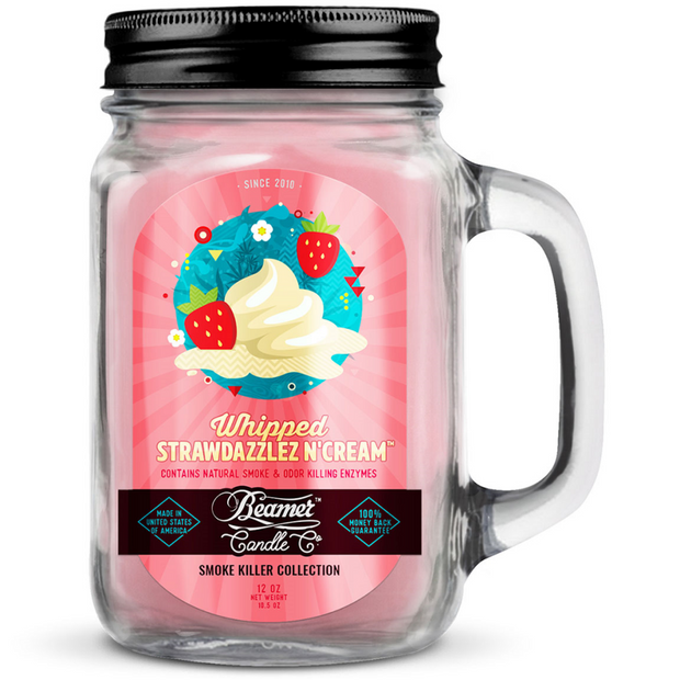 Glass candle jar with a colorful label featuring ice cream and strawberries on a white background