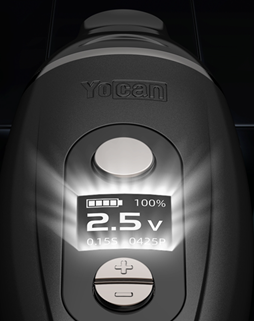 A close-up of a black Yocan Iris Wax kit device with a digital display showing '2.5 V' and '100%', featuring metallic silver buttons on a dark background.