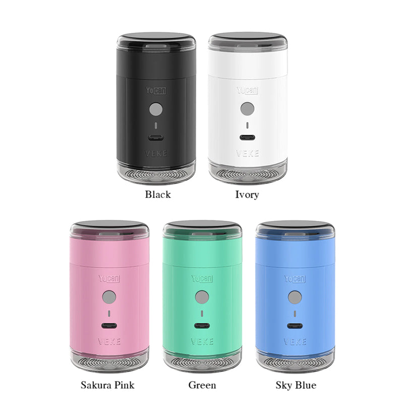 Five cylindrical Yocan Yeke electric grinders shown in different color options on a white background, labeled Black, Ivory, Sakura Pink, Green, and Sky Blue. Each device has a dark top cap, a colored body, a circular button, and a small rectangular detail near the bottom.